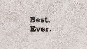 Best. Ever. Is spray painted in black on a wall.